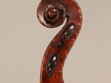 an old violin with a scroll on the back of it