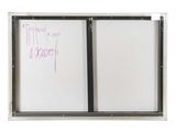 a white board with writing on it in front of a window