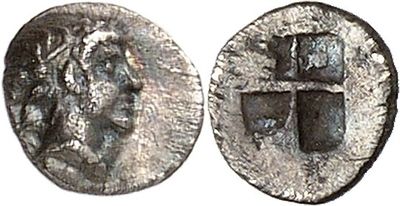 a silver coin with an image of a woman on it