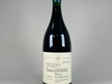 a close up of a bottle of wine on a table