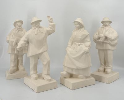 three white statues of men and women standing on a white surface