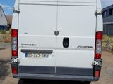 a white van that is parked on the side of the road