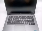 an open laptop computer sitting on top of a white table