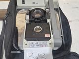 a black bag with a camera on top of it