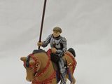 a figurine of a man riding a horse with a flag on it