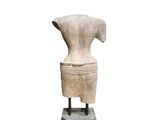 an image of a sculpture of a woman ' s torso on a stand