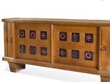 an image of a wooden sideboard with a decorative design