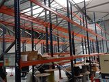 a large warehouse filled with lots of shelves and pallets