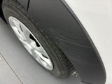 a close up of a tire on a white car