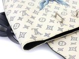 a purse that has a picture of a fish on it
