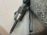 a vacuum that is sitting on the counter in the bathroom