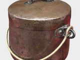 a large metal container with a rope around it