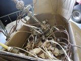 a cardboard box filled with assorted items in a room
