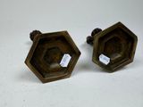 pair of antique brass hexagonal candlesticks with pinecones