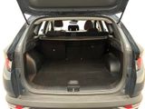 the back of a car with the trunk open and the back seats folded down