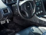 the interior of a sports car with a steering wheel and dashboard