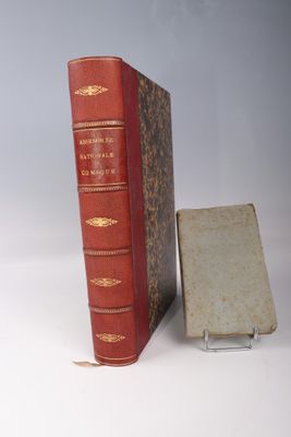 two books sitting next to each other on a table