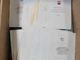a box full of papers and envelopes sitting on a table