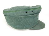 a green hat with a green zipper on it