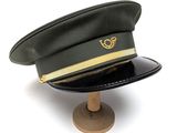 a black hat with a gold logo on it