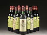 six bottles of wine are lined up in a row on a table