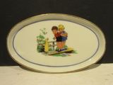 a plate with a picture of a boy and a girl on it