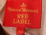 a close up of a red label on a tan jacket