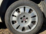 a car that has a flat tire on the side of the road
