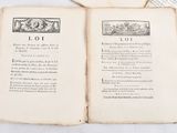 an old book opened to a page with a picture of a man and a woman on it