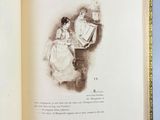 an open book with a drawing of a man and a woman sitting on a chair
