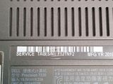 a close up of a laptop with a barcode on it