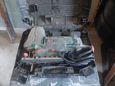 a tool in the case that is sitting on the floor