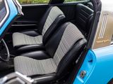 an image of a blue car with black and white checkered seats