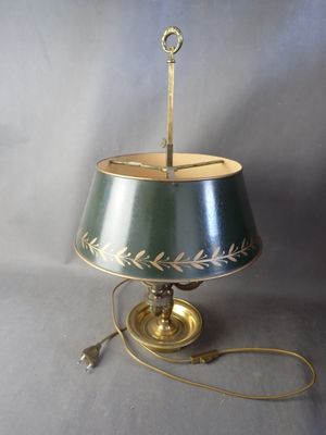 lamp with a green shade and a gold base with a leaf design