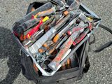 a suitcase full of tools sitting on the ground