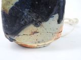a close up of a cup with a black cat on it