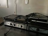 a black counter top with a bunch of appliances on it
