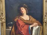 an image of a painting of a woman holding a book