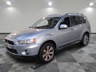 a picture of a silver suv parked in a garage