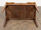 an old wooden table with two bowls on top of it