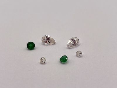 four different types of diamonds on a white surface
