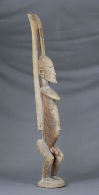 an image of a statue of a person holding a surfboard