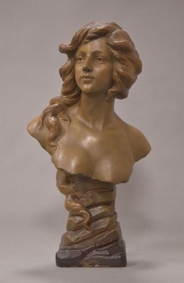bronze bust of a woman with wavy hair on a marble base