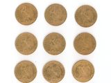 six different types of gold coins on a white surface