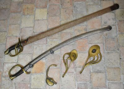 a sword and a pair of scissors on a brick floor