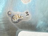 a close up of a metal plate with a number on it