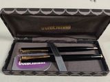 a black case with a pair of scissors in it