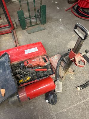 a red machine that is sitting on the ground