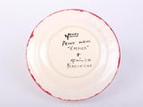 an image of a white and red plate with writing on it