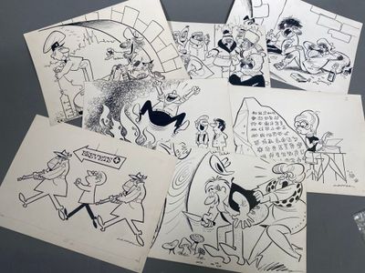 several drawings of cartoon characters are shown on a table